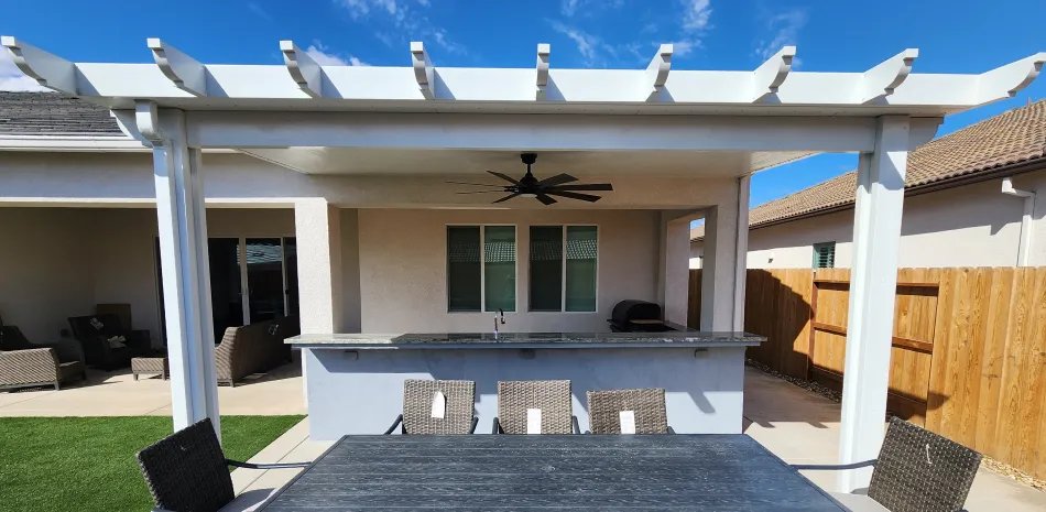 White patio cover over a new patio with outdoor bar seating