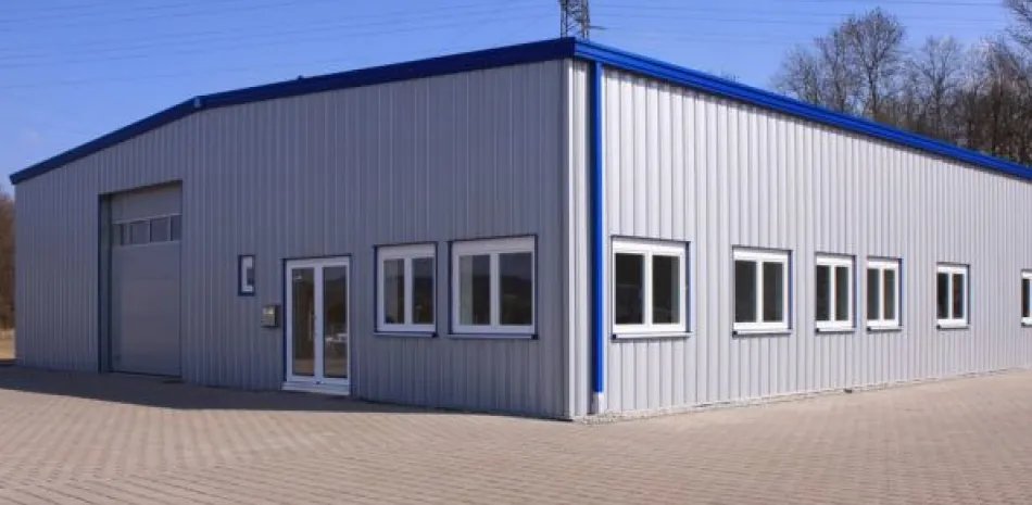 Light gray steel building with roll-up door and windows in Orangevale, CA